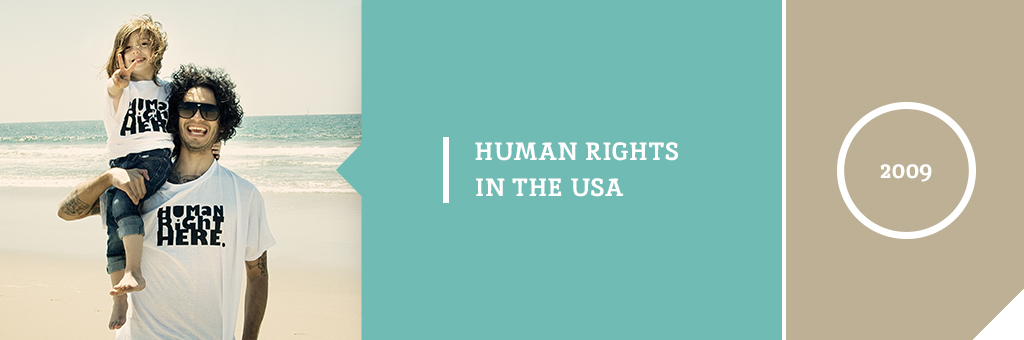 An image of a man holding a child, both wearing a shirt that reads "Human right here" next to the text "Human Rights in the USA 2009"